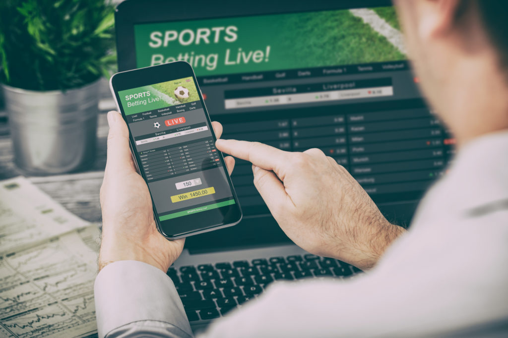 Man checking out sports betting odds