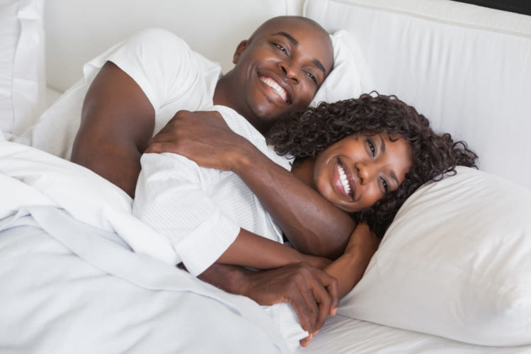 happy couple in bed
