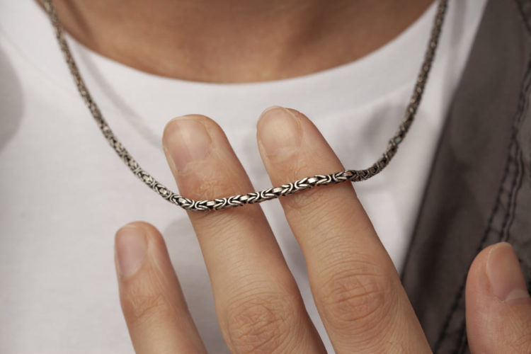 man wearing a chain necklace