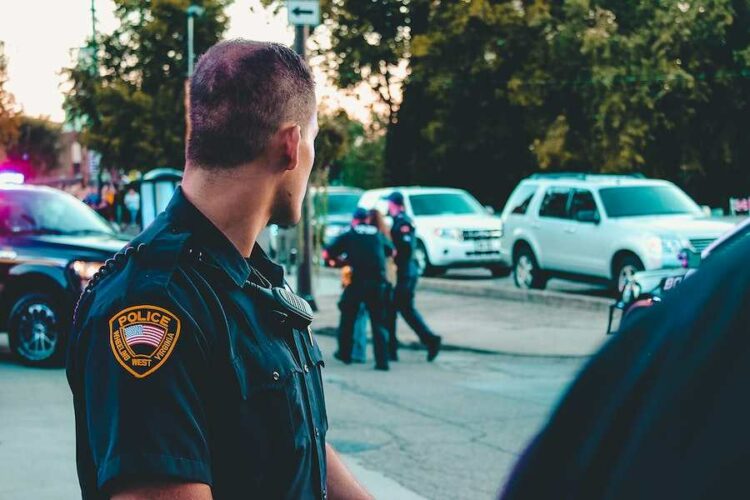 why do american police touch the back of cars